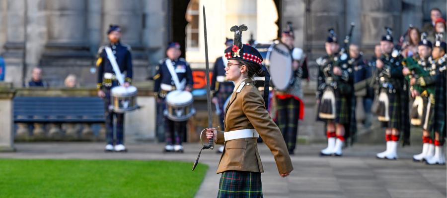 Image of military cadet marching at Old College during Remembrance Sunday Service 2023