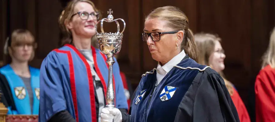 The Bedellus carrying the ceremonial mace