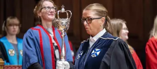 The Bedellus carrying the ceremonial mace